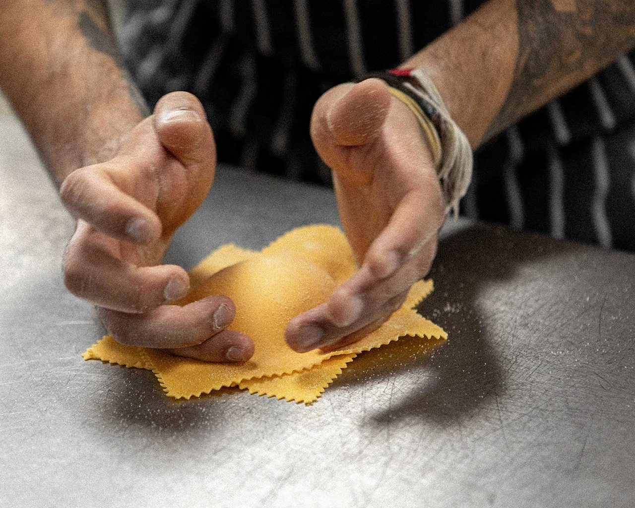 A chef preparing ravioli