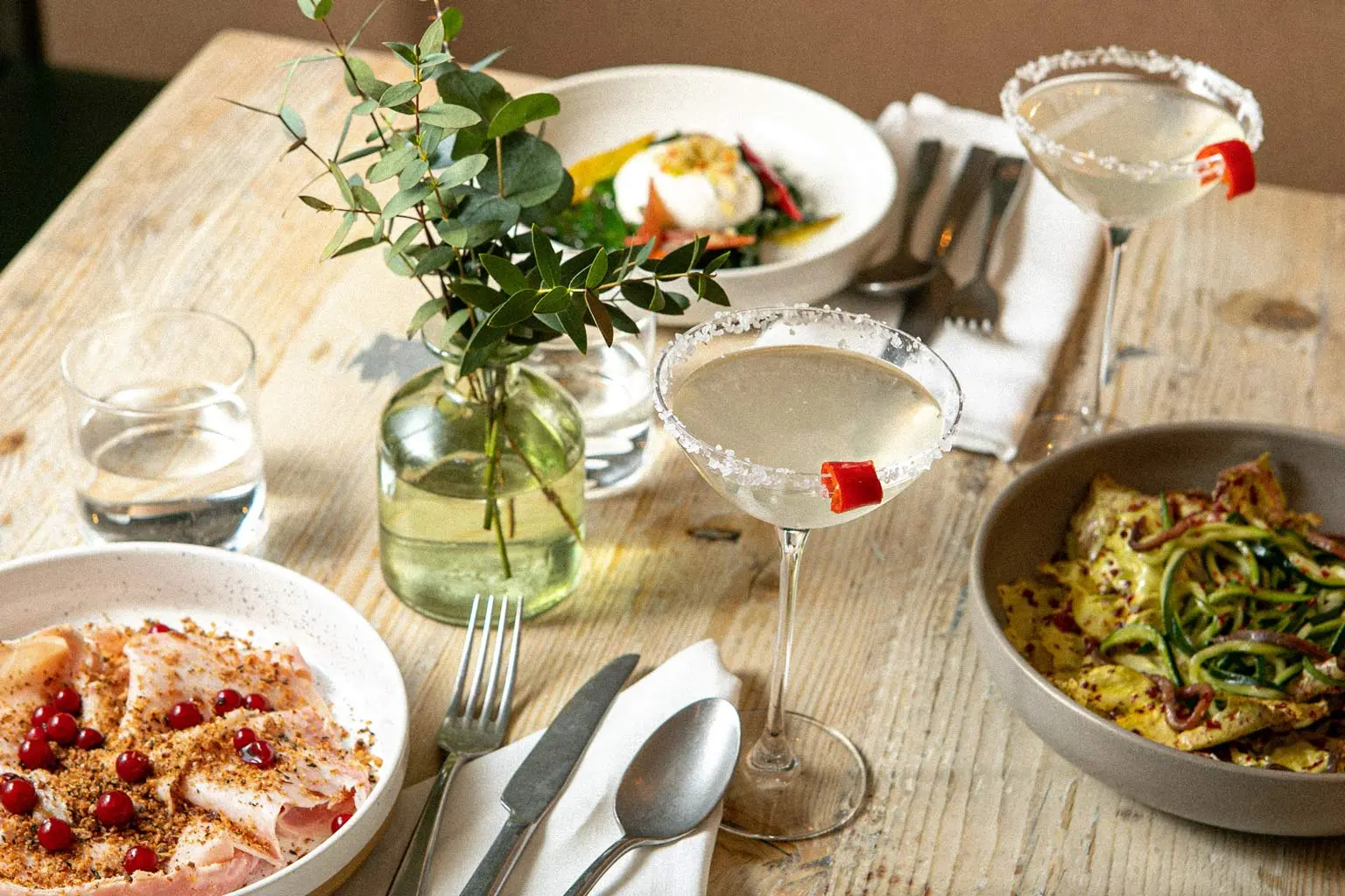 Two spicy Margaritas with a small plates